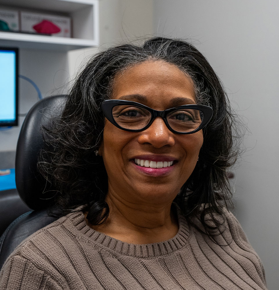 yolanda smiling with her new dental implants