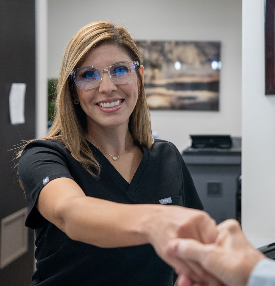 office coordinator shaking hands with henry