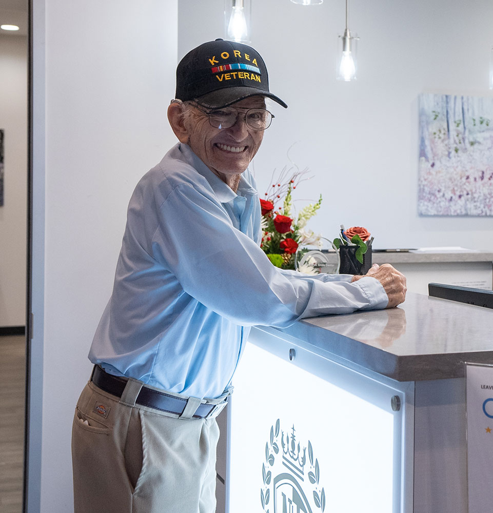 henry at counter talking to the front desk