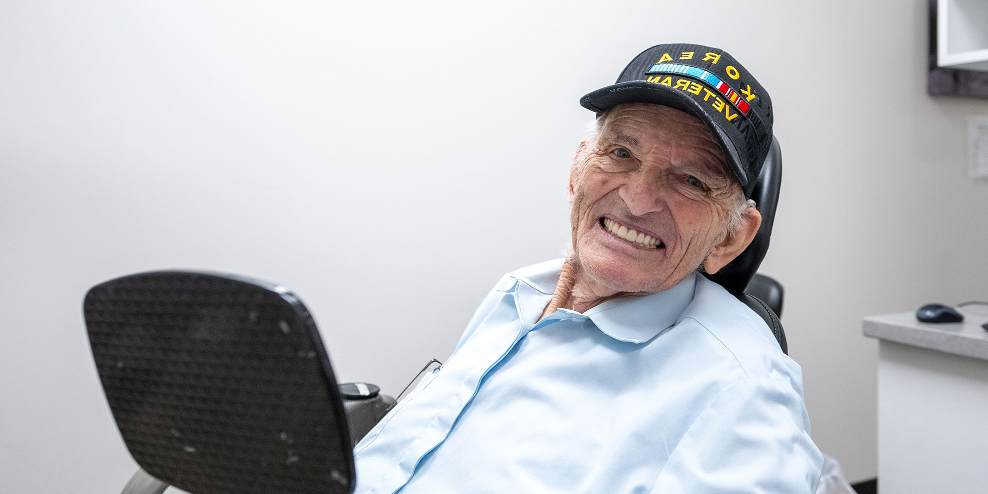 henry with his new smile thanks to dental implants