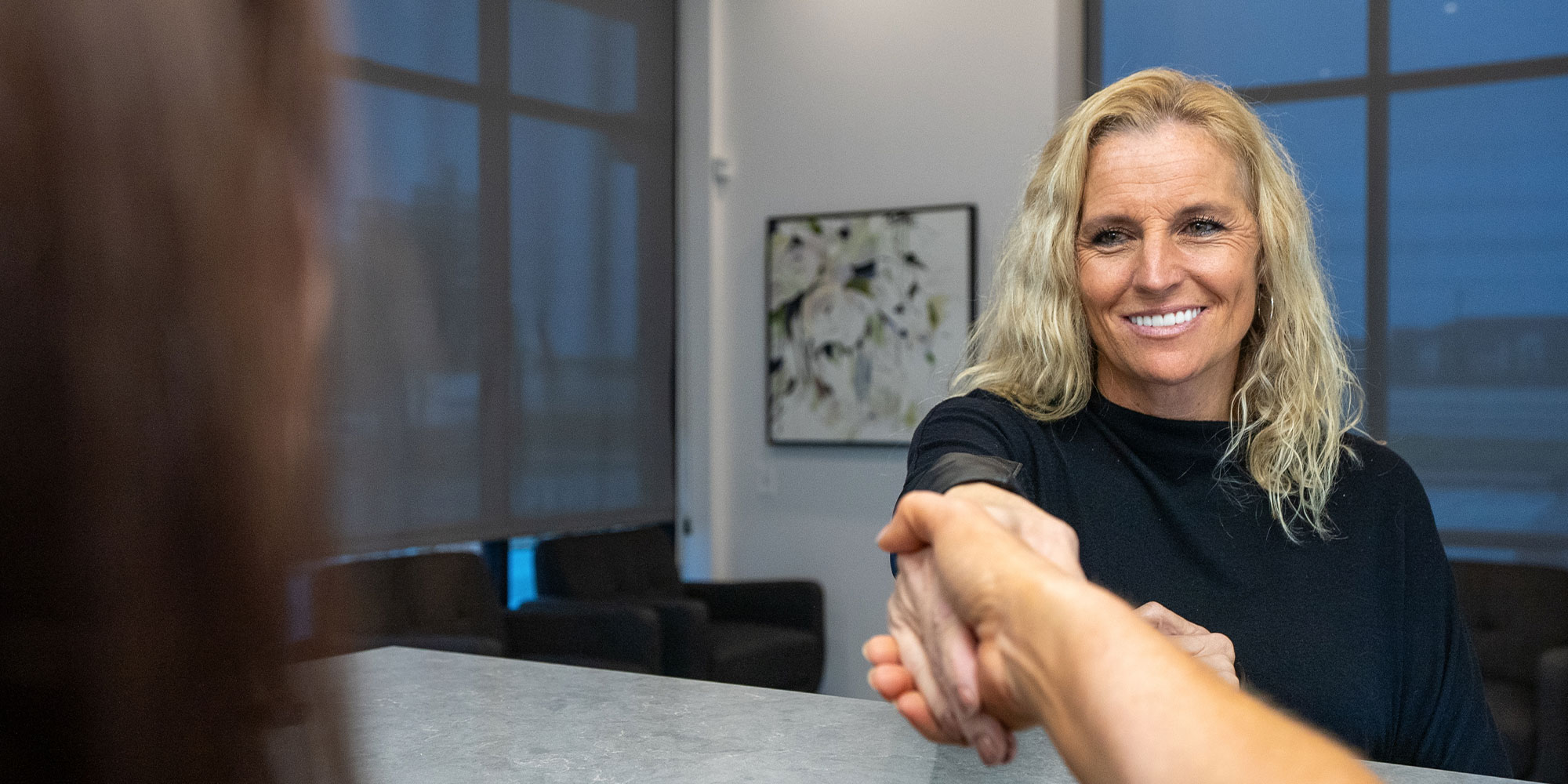 jen with new me employee at front desk